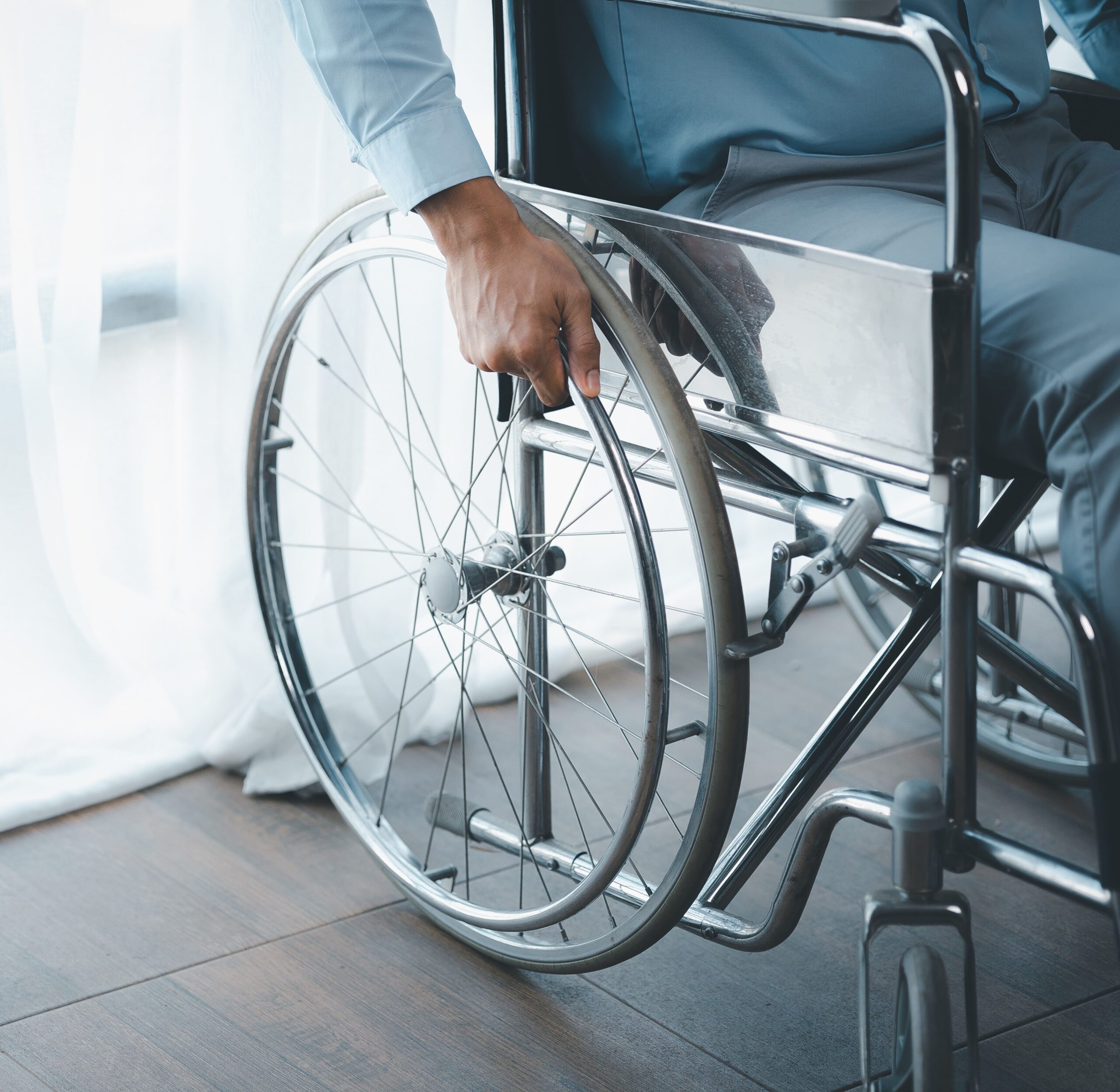 man-sitting-on-a-wheelchair-man-with-a-wheelchair-2023-01-31-00-47-20-utc